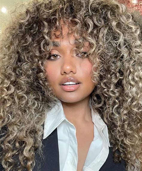 blonde highlighted curly hair|More.